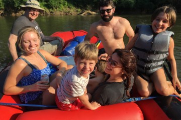 a group of people sitting on a boat